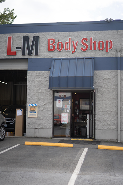 Front entrance and office door of L-M Body Shop, Suite A140, Kirkland