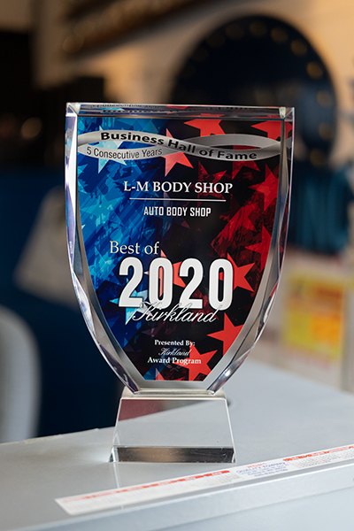 Best of Kirkland 2020 Business Hall of Fame award on the L-M Body Shop counter